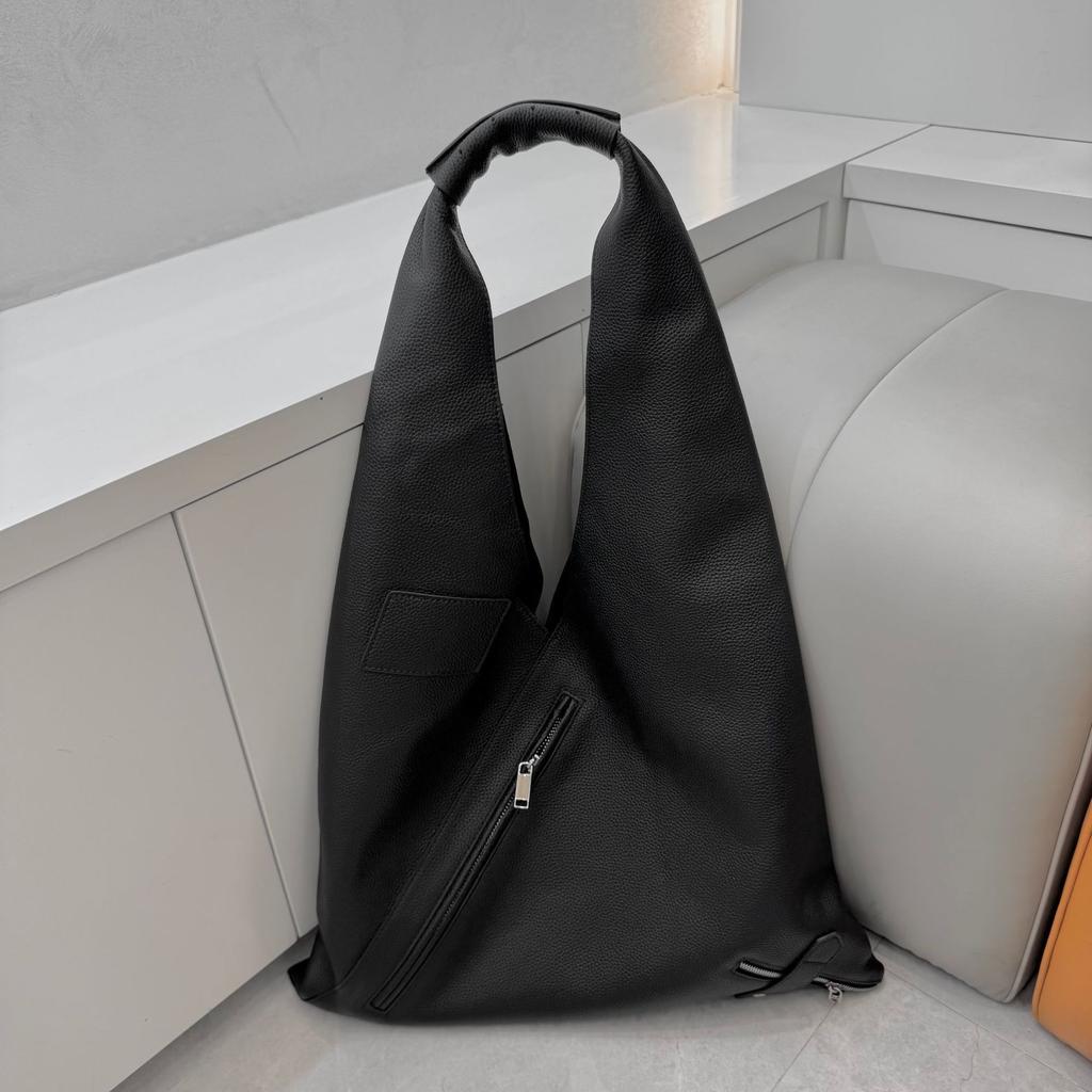 Cross-border first-layer cowhide commuter large-capacity women's bag zipper triangle bag versatile portable shoulder lazy wind underarm bag