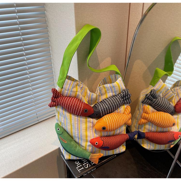 

Large capacity canvas bag women s summer new versatile striped shoulder bag popular commuter bucket bag