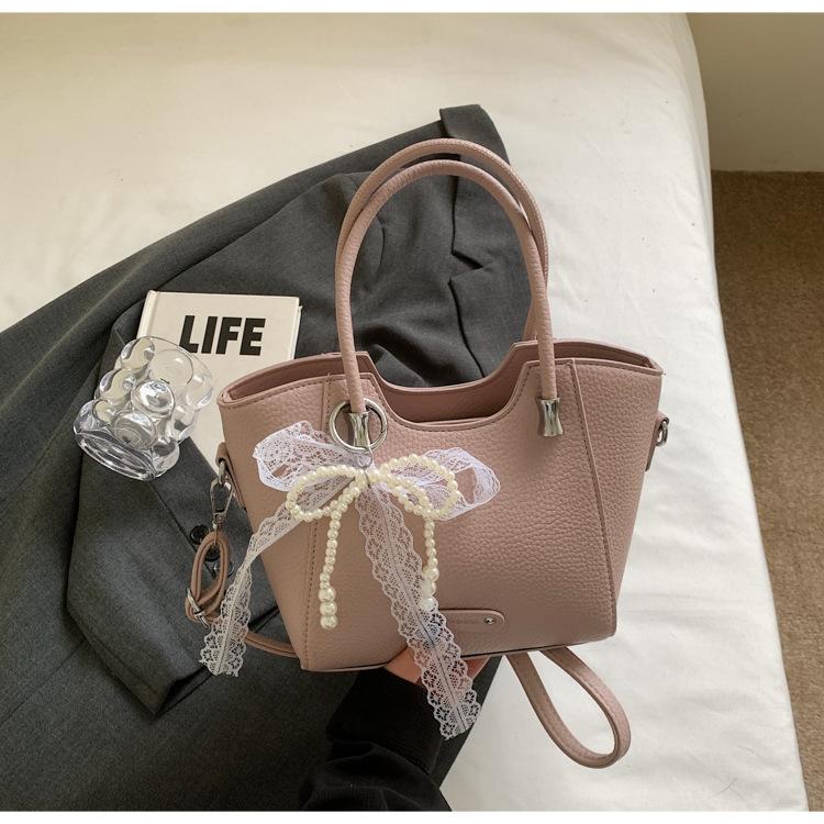 Korean version of the trend hand-carried bucket bag women's summer 2025 new simple fashion versatile shoulder bag niche high sense