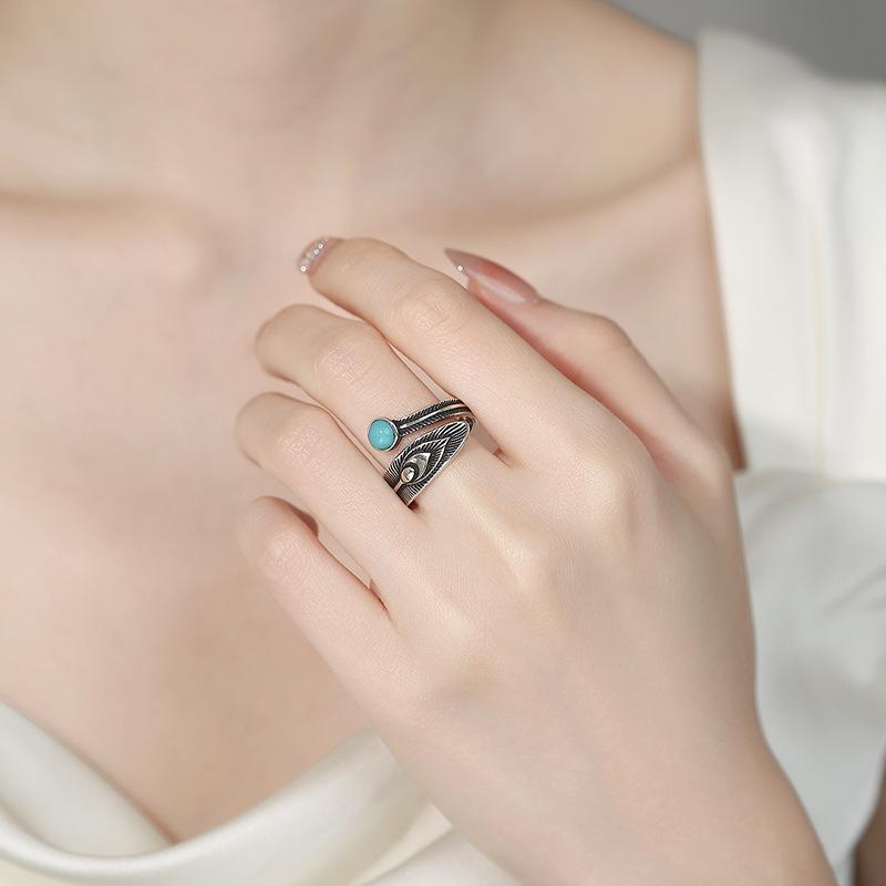 Vintage turquoise feather ring with adjustable opening.