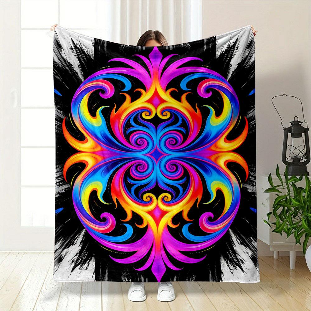 A vibrant, symmetrical swirl pattern with neon hues on a black background. for all seasons blanket lunch break throw gift