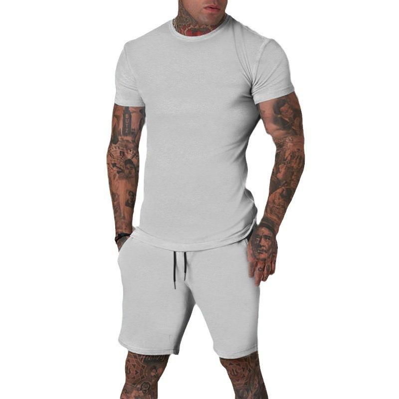Conjunto de Camiseta de Manga Corta y Pantalones Cortos de Color Sólido para Hombre de Verano - Transpirable y Elegante.