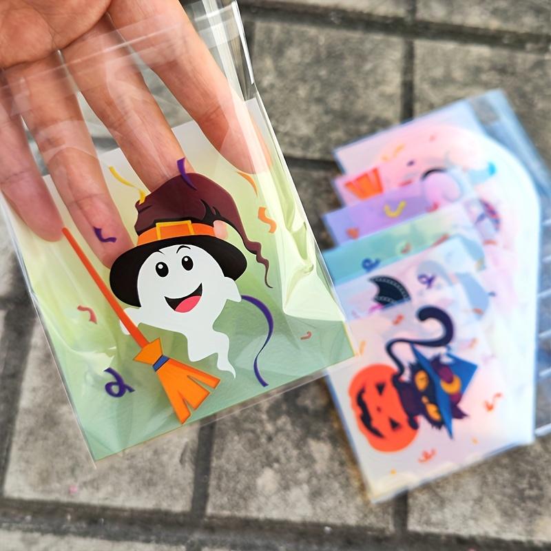 100pcs Halloween Gift Bags. Self-adhesive with pumpkin, ghost & bat designs for party treats.