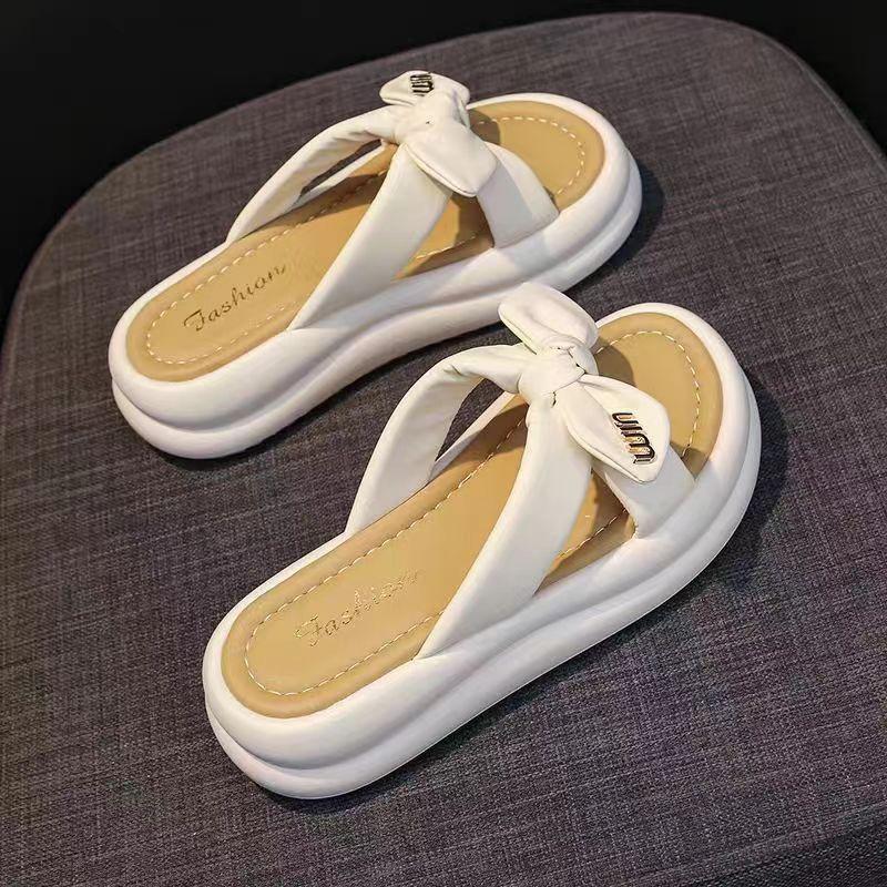 2025 sommar nya mjuka botten rosett tofflor damkläder tjock botten höjdökande avslappnade halkfria ord strand sandaler