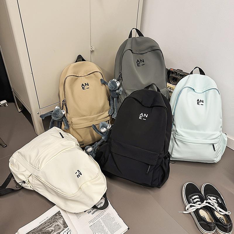 Korean version couple simple large-capacity backpack leisure commuter college student schoolbag niche light travel backpack women
