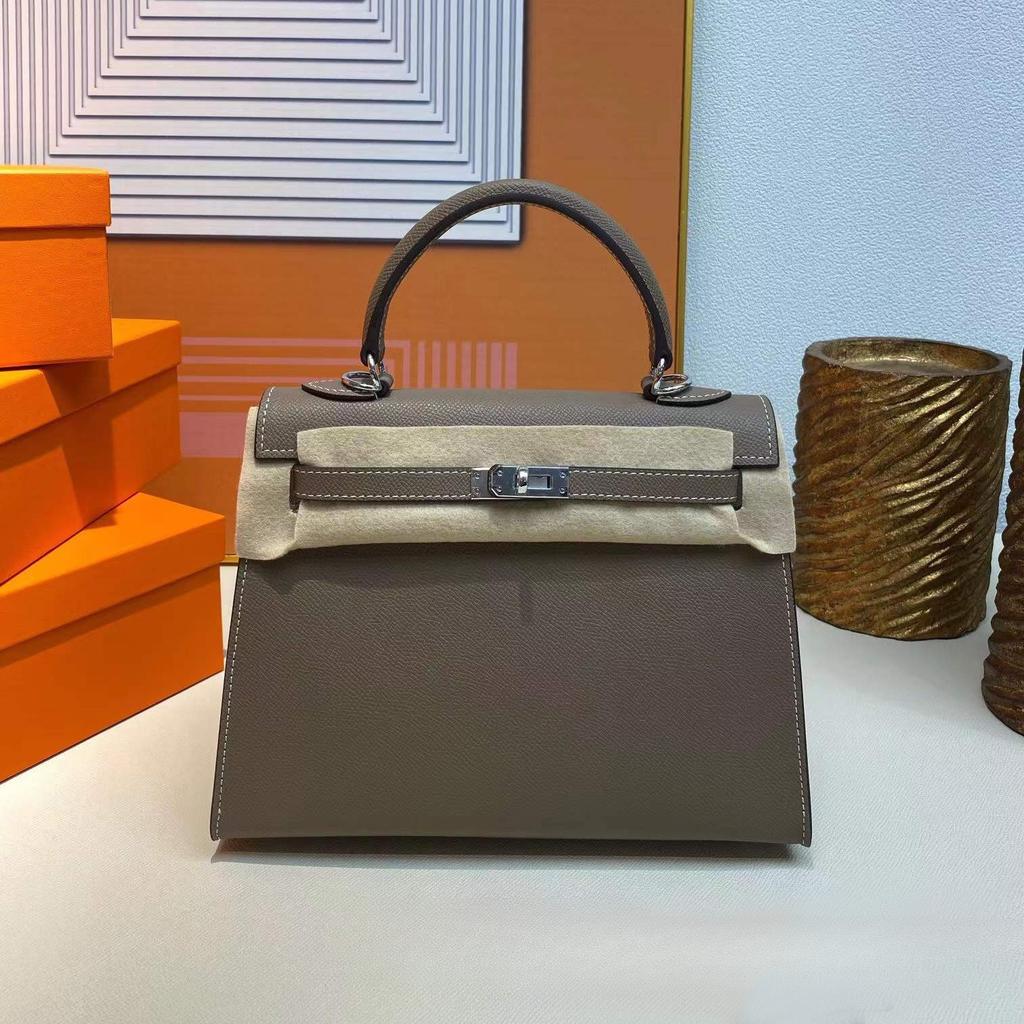 Grenzüberschreitende Hersteller Großhandel Damenhandtaschen 2023 neue Handtaschen aus Leder mit Palmenmuster tragbare Schulter-Umhängetaschen Damenhandtaschen große Kapazität