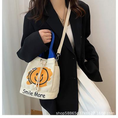 Neue Graffiti-Smiley-Gesicht-Canvas-Tasche, einfache und tragbare Handtasche, süße Umhängetasche, Tasche Frau