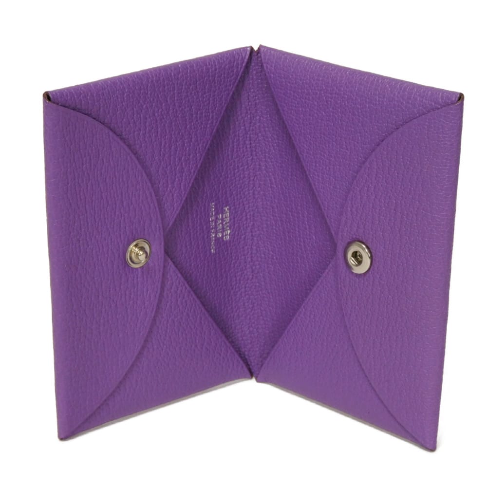 Used 9212 Calvi 7946 Chevre Mysore Goatskin Bag with Gold-stamped Logo and Purple Snap Buttons. Excellent Condition.