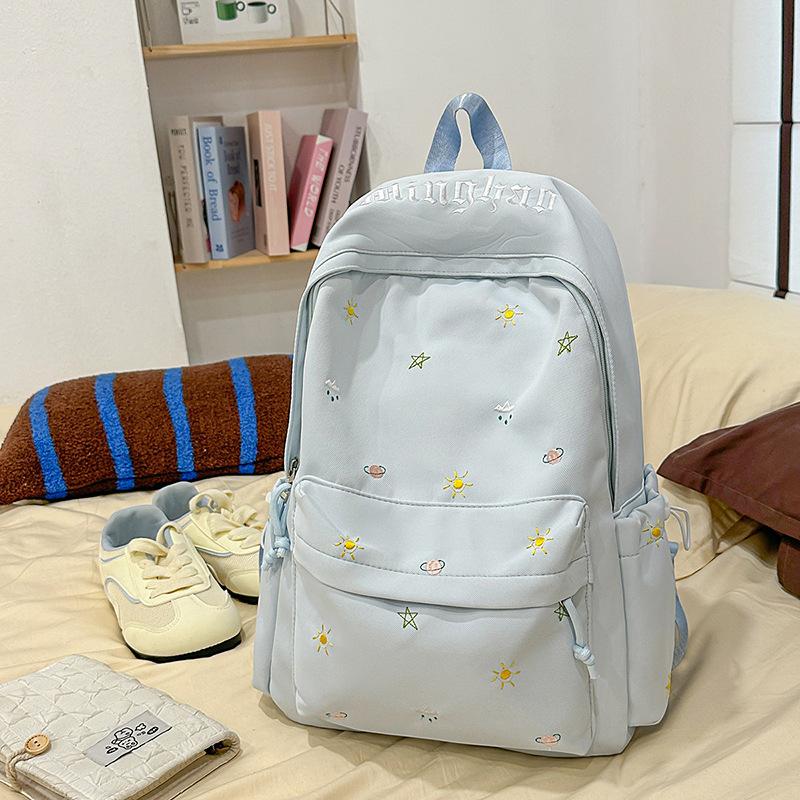 Design sense dopamine embroidery large capacity junior high school bag ins niche female high school student lightweight backpack