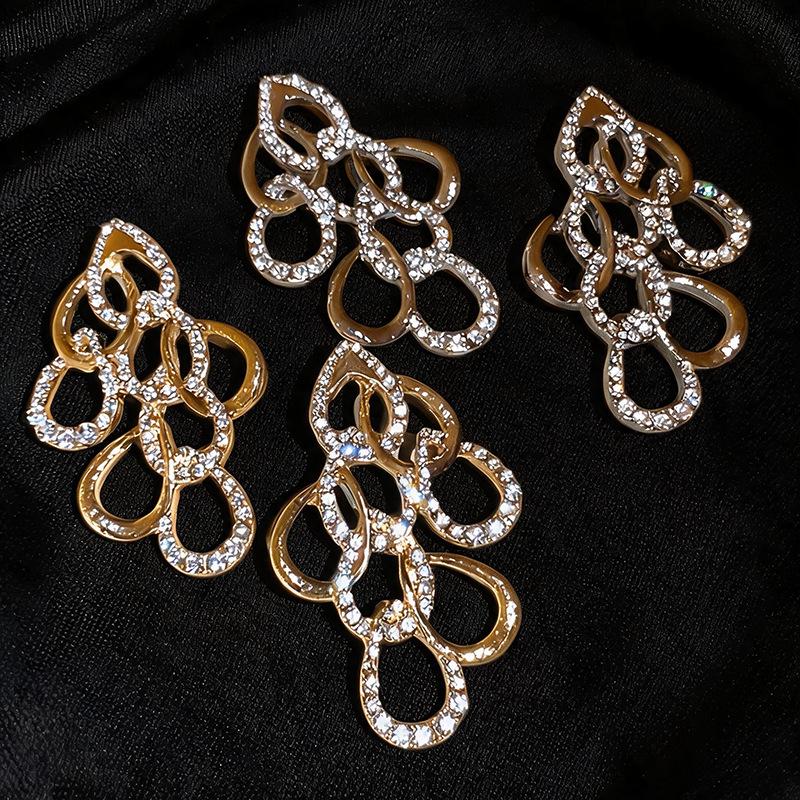 Elegant Water Drop Diamond Hollow Earrings - Silver Needle, European & American Style, Exaggerated Fashion, Luxurious High-End Design.