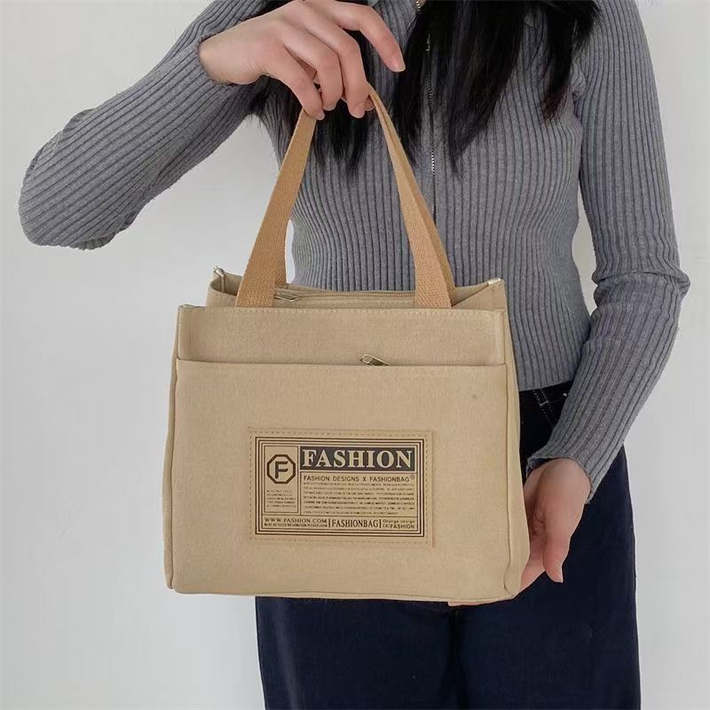 High-value canvas handbag, simple and portable for office workers, casual handbag, lunch box, and handbag.