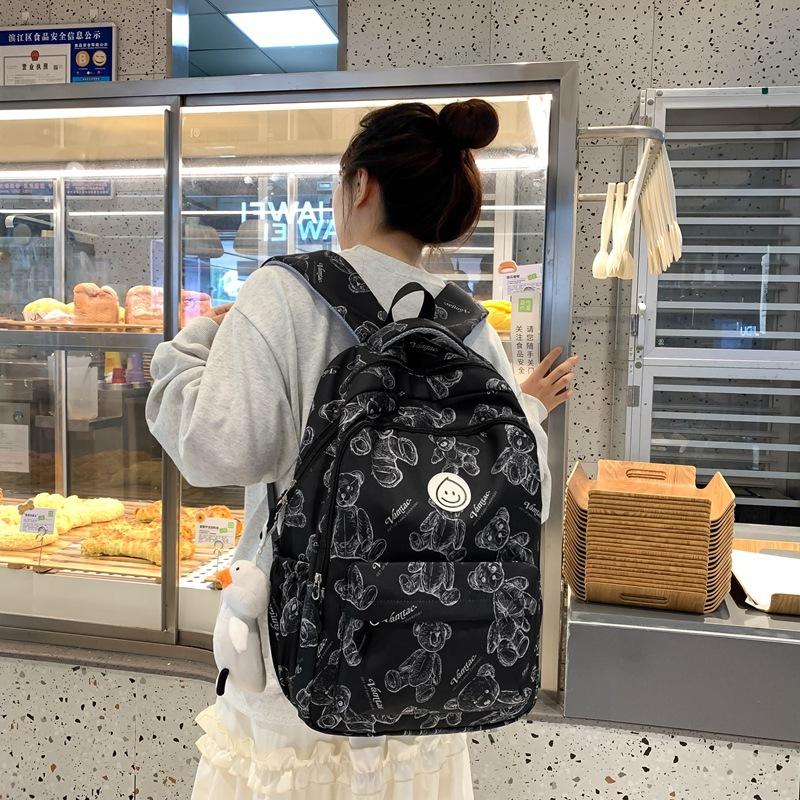 

Graffiti backpack female college students niche design high school students junior high school casual backpack large capacity schoolbag new чорний