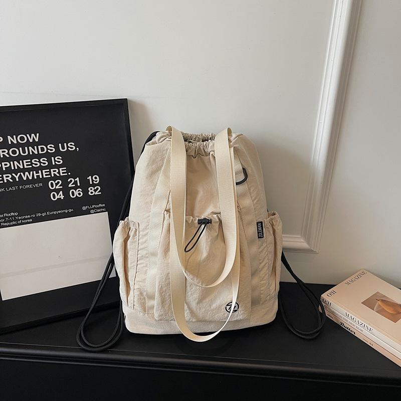 2026 Spring New Outdoor Backpack Large Capacity Simple Fashionable Lightweight Cloth Bag Travel Shoulder Bag Casual School Bag