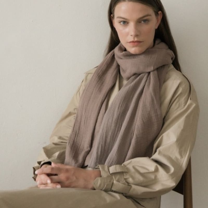 

BB’DE SOLI’DE has a beige scarf beige