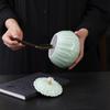Celadon Ceramic Tea Canister: Large Half-Pound Capacity Storage for Green or Black Tea - Porcelain Sealing Jar with Printed Design.