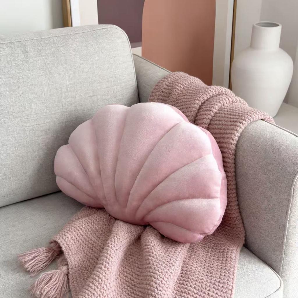 A seashell-shaped pillow, suitable for living room sofas, bedrooms, offices, and home decor.