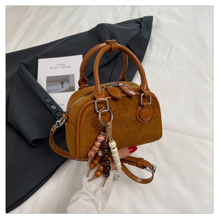 High-end niche bag women's 2025 new fashion messenger bag Korean version retro hand-held bowling bag shoulder bag