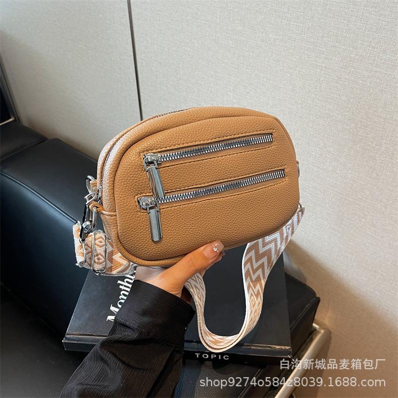 

Korean version of the new girl s mobile phone breast bag simple pu messenger bag trendy fashion zipper women s shoulder small round bag