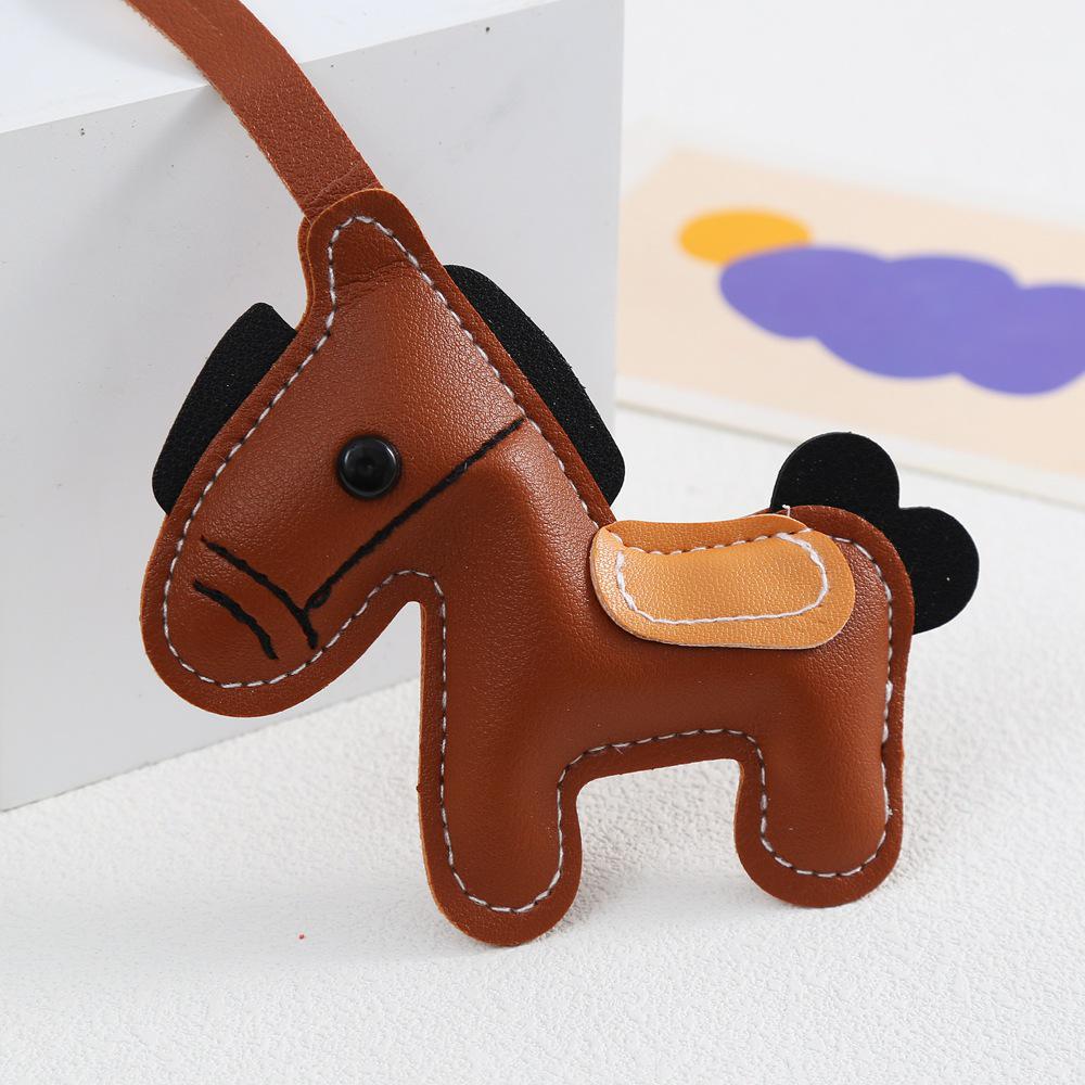 Neuer reicher Stil Lederpuppen-Rucksack Schlüsselanhänger Schmuck