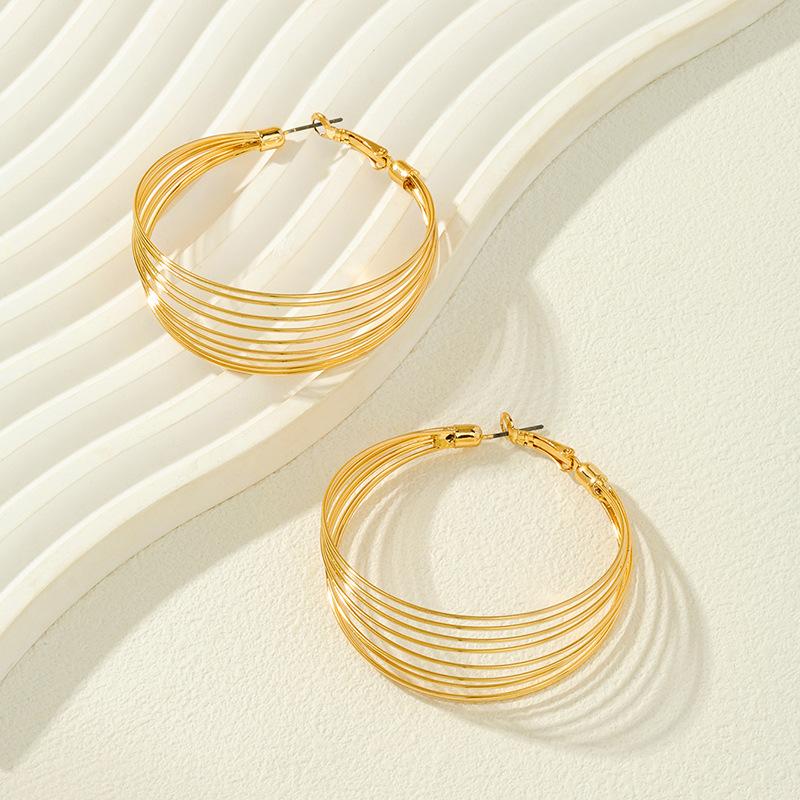 Meier New earrings: metal spring hoop earrings - vintage, statement, fashionable, and minimalist jewelry золотой