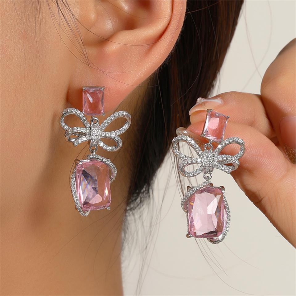 

ZAKOL Вишукані сережки-підвіски ручної роботи з інкрустацією цирконами у вигляді банта та метелика для жінок, великі рожеві та блакитні кристали CZ, циркони для весільної вечірки рожевий