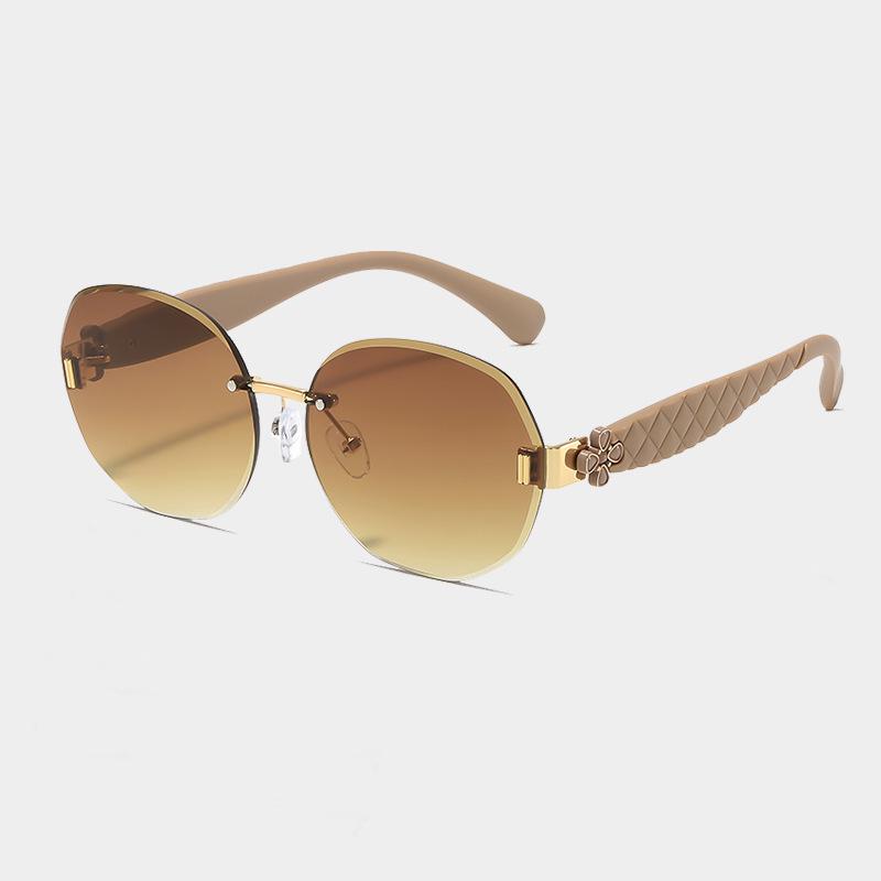 Women's Egg-Shaped Stylish Frameless Retro Sunglasses for Summer Photoshoots
