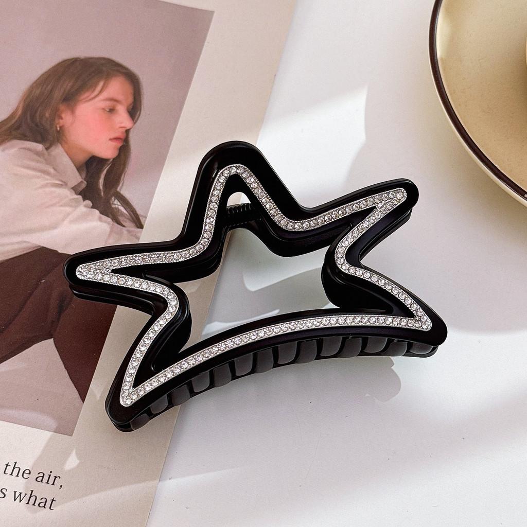 Elegant stjärnformad hårklämma för kvinnor med fantastiska strass i svarta och bruna toner