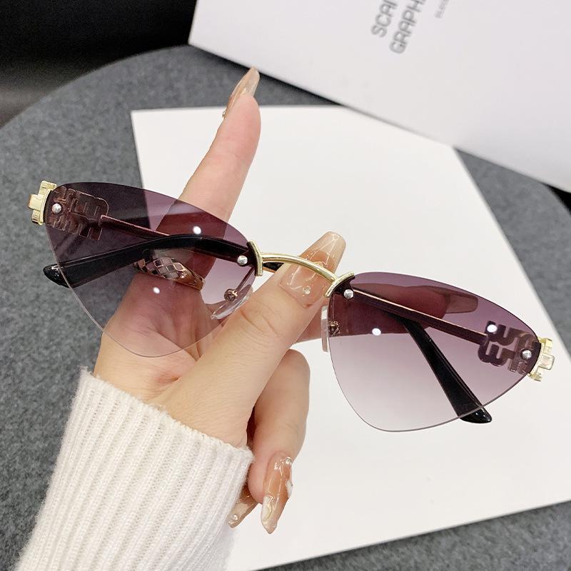 Miao's Frameless Cat-Eye Sunglasses: Women's High-End European & American Style with Hollow Letter Design.