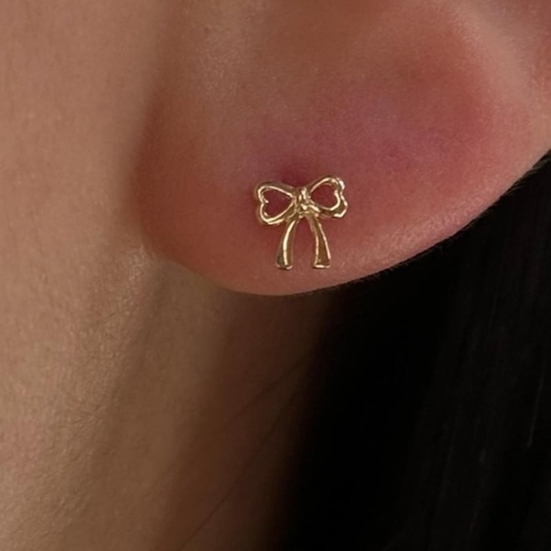 

MARKING 10k 14k Aime Ribbon Piercing 10k yellow gold