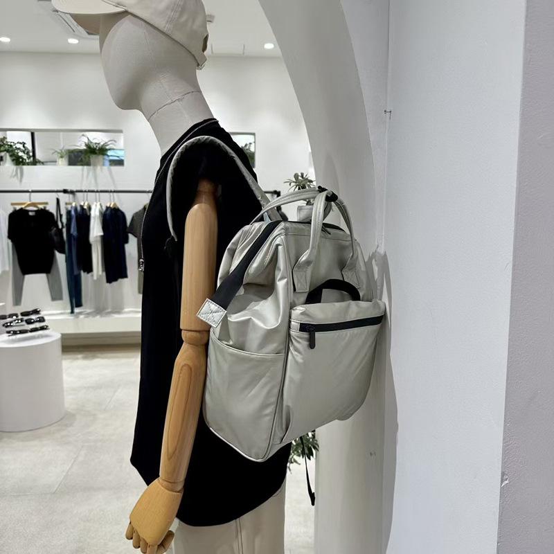 Značka módního návrháře Dámský a pánský batoh Trendy styl Taška na notebook 15,6 palce PU kůže Businessový ruksak Dámská školní taška