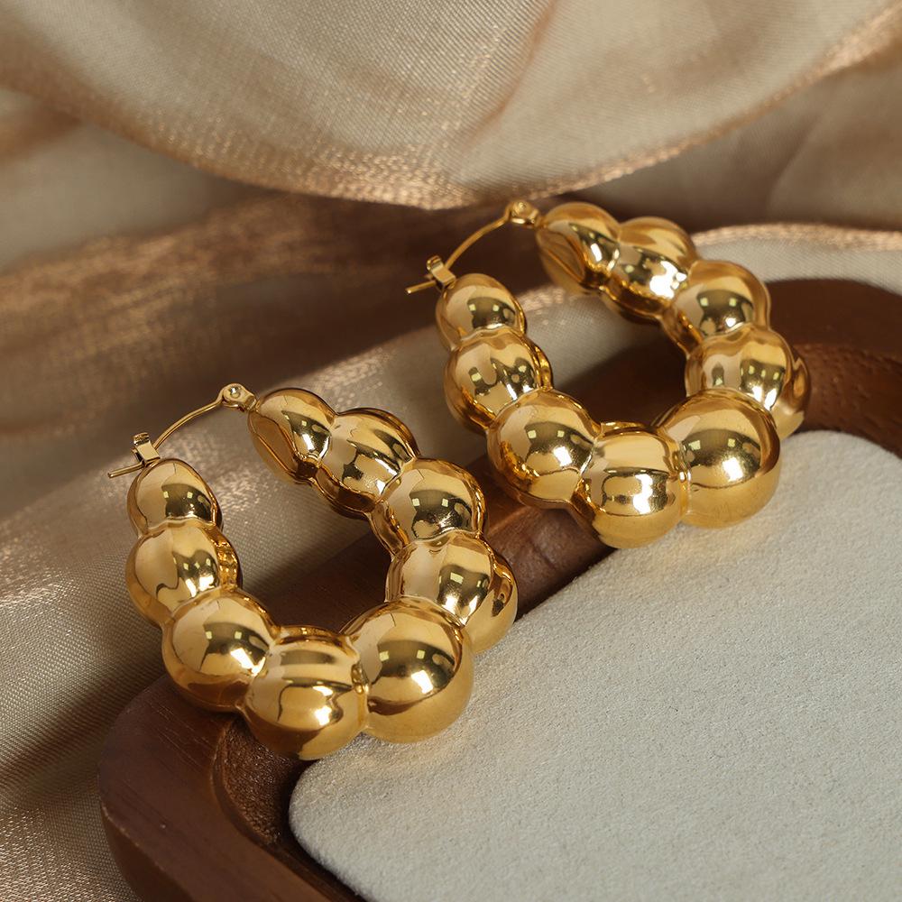 

Textured Gold-Plated Titanium Steel U-Shaped Earrings with Steel Ball Design