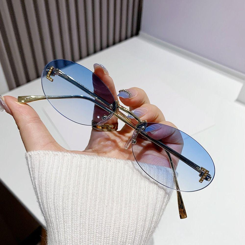 Modische ovale Sonnenbrille für Damen, Luxusqualität, Buchstabendekor, Sonnenbrille, trendige randlose Katzenaugen-Brille, UV400-Schutz, Metall