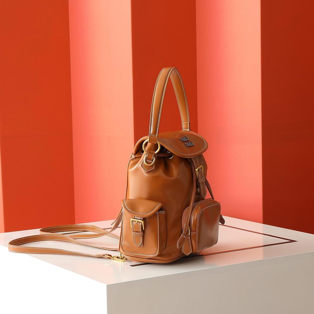 Nový Miao miu 2025 plátěný batoh velkokapacitní prémiový pocit všestranný přenosný ramenní cestovní dojížděcí batoh