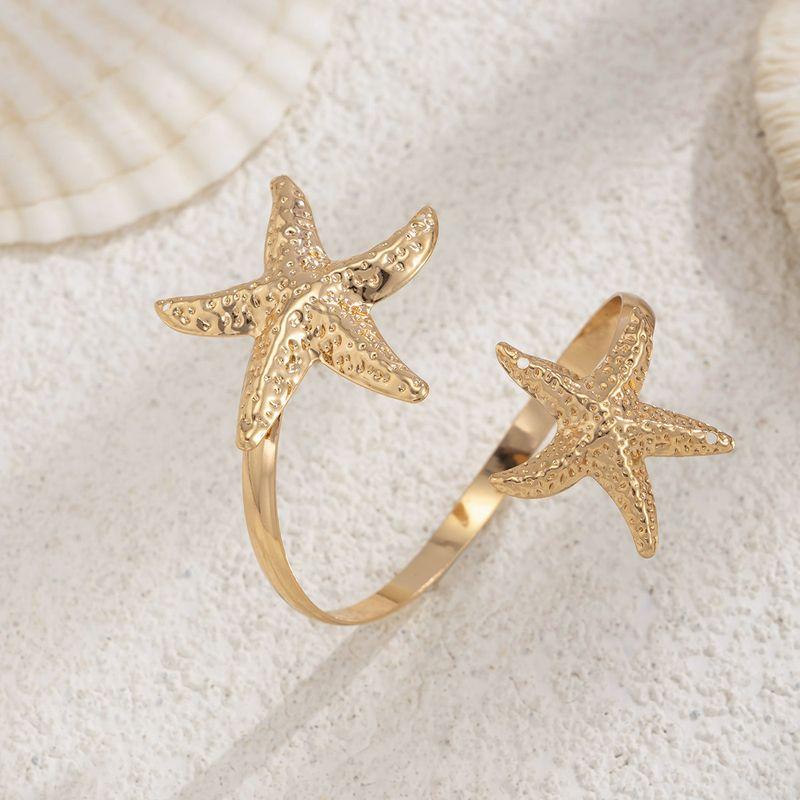Metal Flower Starfish Arm Bracelet for Women 2026 Spring and Summer New European and American Fashion Influencer Travel Photo Shoot Matching Arm Band