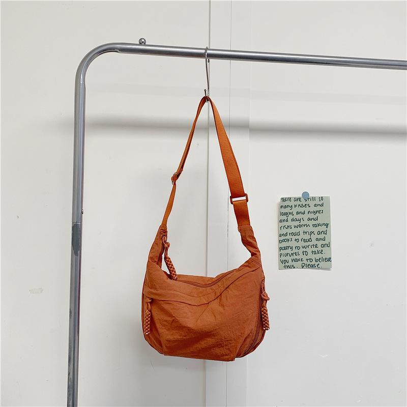 

2025 Women s Large Capacity Nylon Dumpling Shoulder Bag – Japanese Style, Versatile, and Simple Crossbody for Commuting помаранчевий