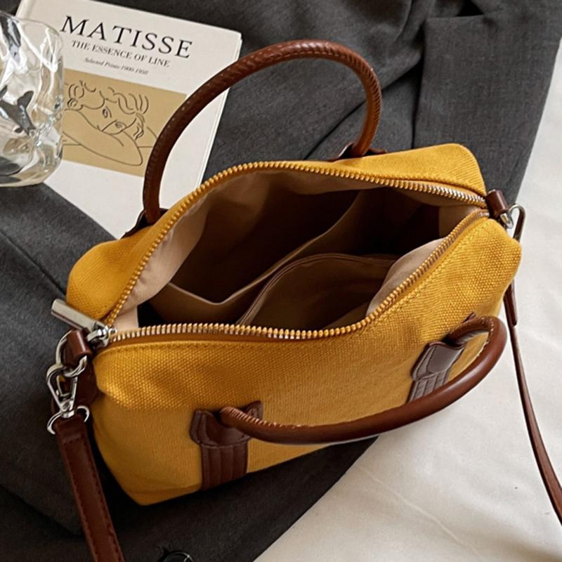Classic Canvas Duffel Bag with Leather Trim and Adjustable Strap Perfect for Travel and Everyday Use