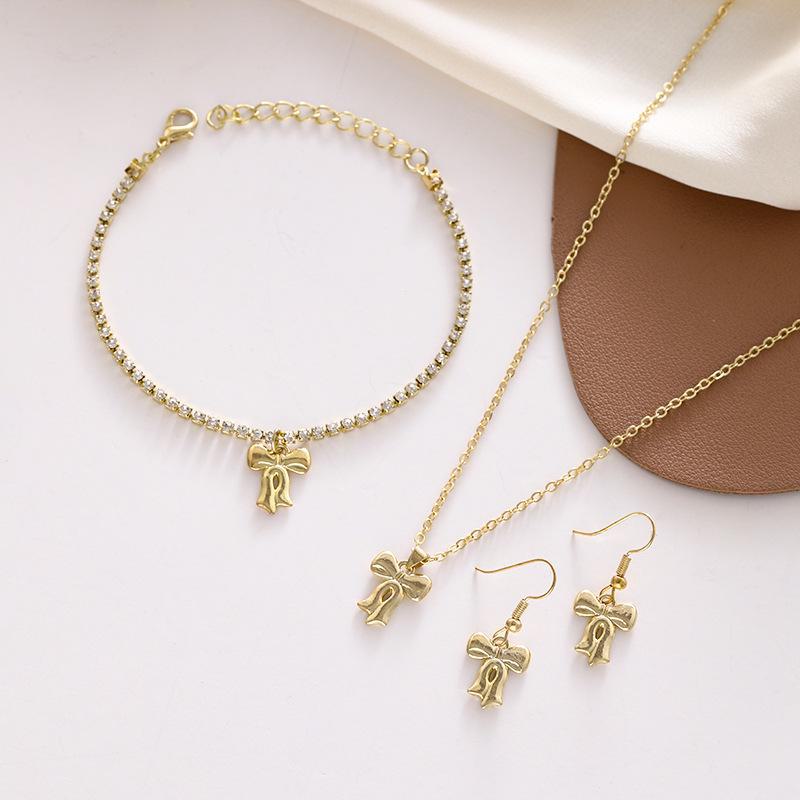 

Роскошный комплект украшений в виде банта: Ожерелье, браслет и серьги для женщин 3-piece set золотой