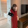 Autumn and winter new design sense niche single-breasted black bottom skirt knitted sweater dress women