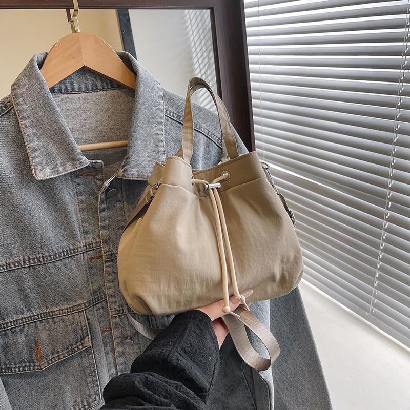 Casual Niche Drawstring Hand-held Bucket Bag Crossbody Bag for Women 2026 New Trendy Versatile Simple Small Bag Cloth Bag