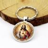 Moderne minimalistische Glaslegierung Schlüsselanhänger mit Herz Jesus Charakter Anhänger zum Verschenken
