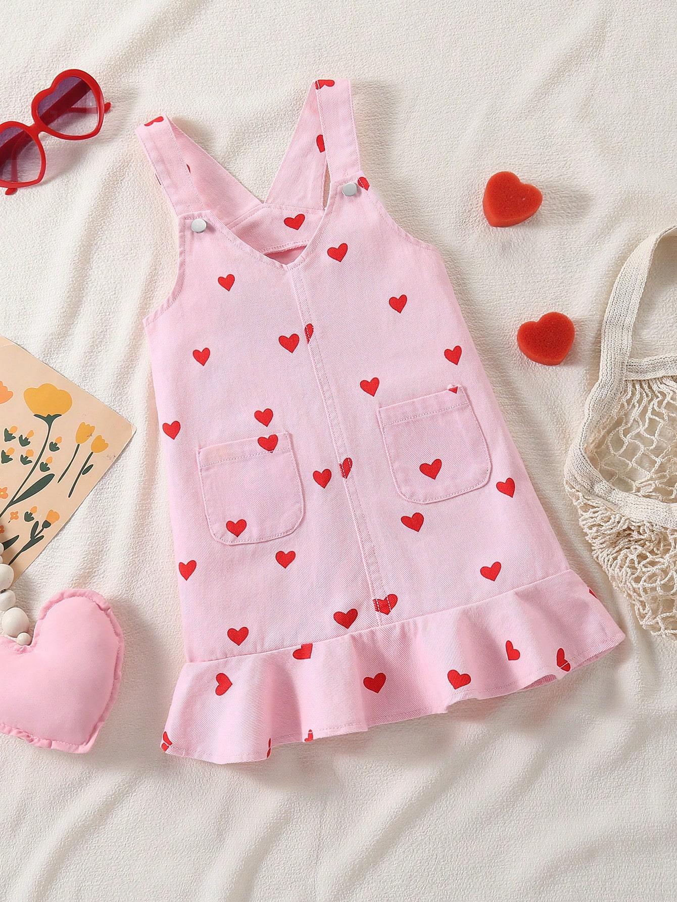 

Single-piece girls everyday outdoor dress with pink all-over print of red hearts and ruffles, cute and stylish. 4Y