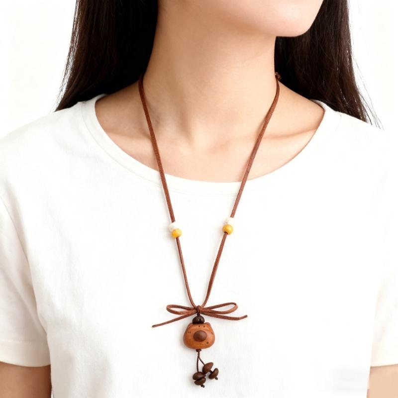 Einzigartiger Zugband Kaffeebohnen-Bären-Anhänger an verstellbarer Halskette im Retro-Stil