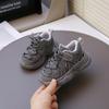 Children's sports shoes spring 2025 new light casual soft sole versatile pair of net shoes dad shoes male and female students