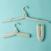 Compact Travel Folding Hanger: Portable & Multi-functional for Trips & Dorms, Patented Design