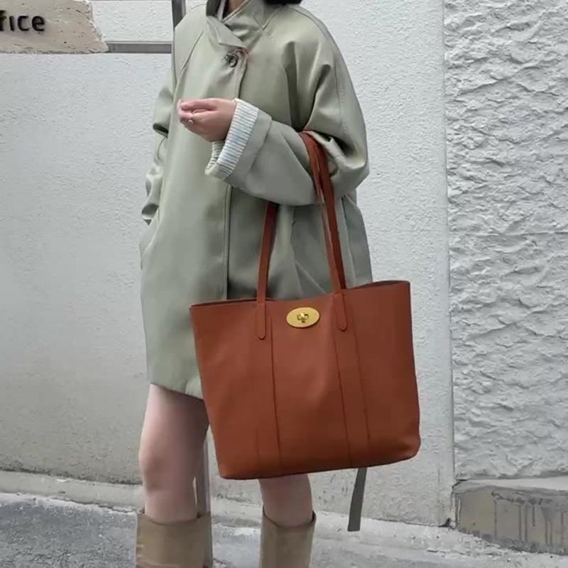 The first layer cowhide women's bag, the new simple and versatile commuter large-capacity tote bag, portable shoulder bag.