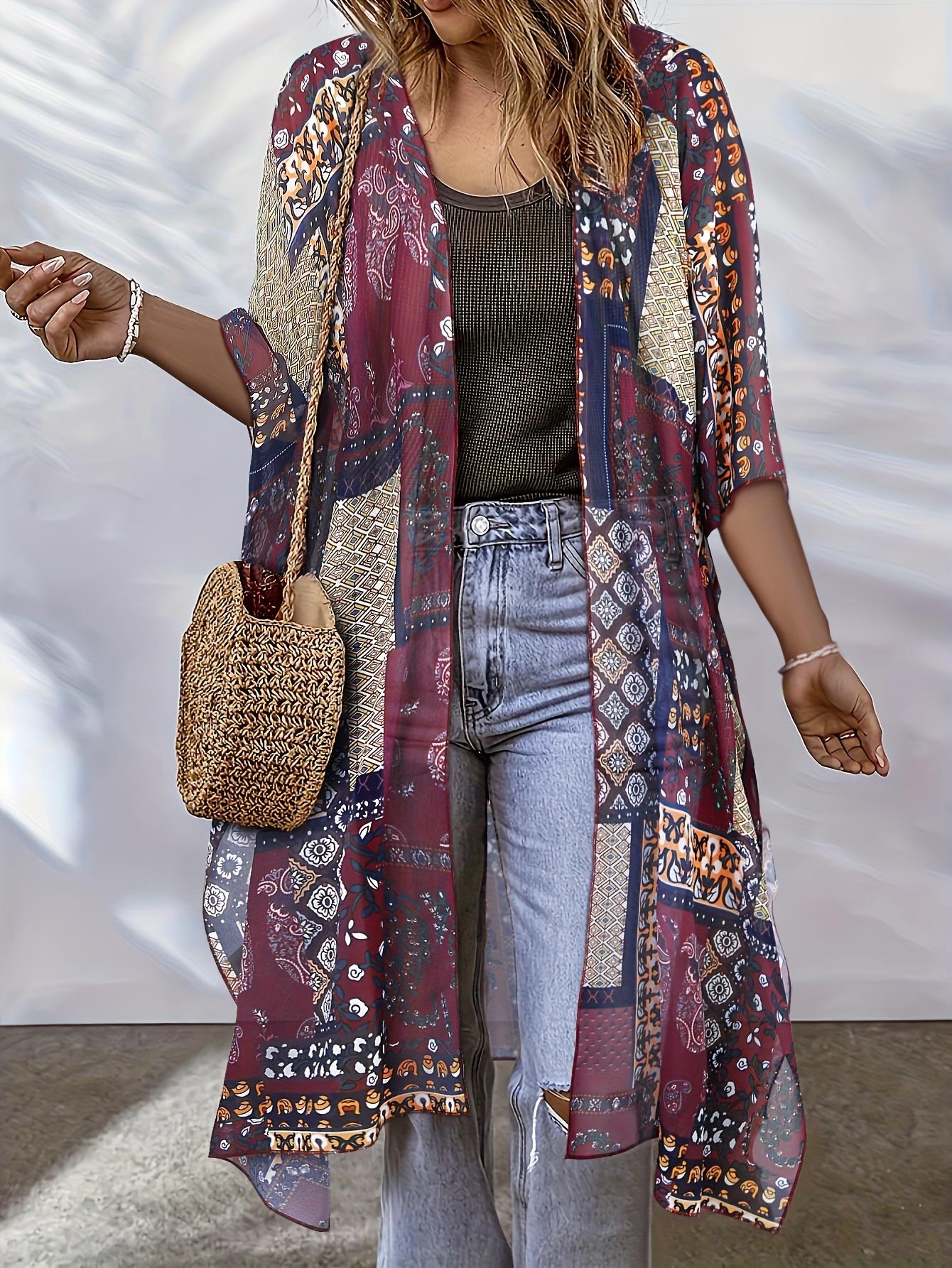 

Женское кимоно в стиле бохо, свободного кроя с геометрическим принтом по всей поверхности, полупрозрачная пляжная накидка с V-образным вырезом и разрезами по бокам. One-size