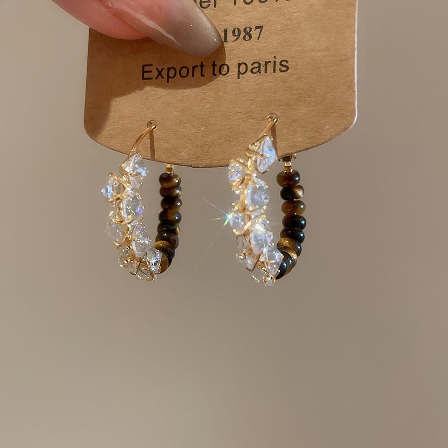 Silver Needle Tiger's Eye Style Earrings: Elegant, Fashionable Studs with Caramel Color Finish.