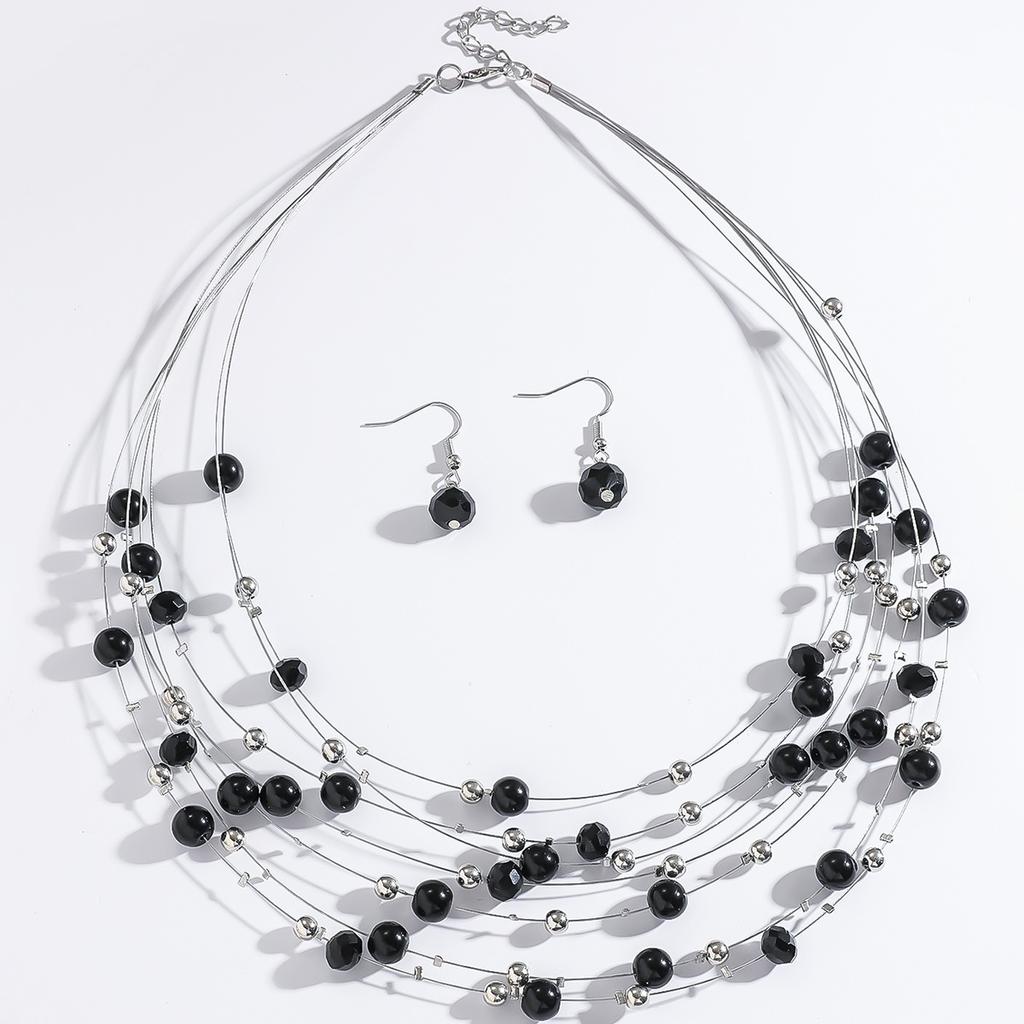 Ensemble bohème rétro pour femme : collier et boucles d'oreilles à plusieurs rangs de cristaux turquoise, style bohème exagéré.