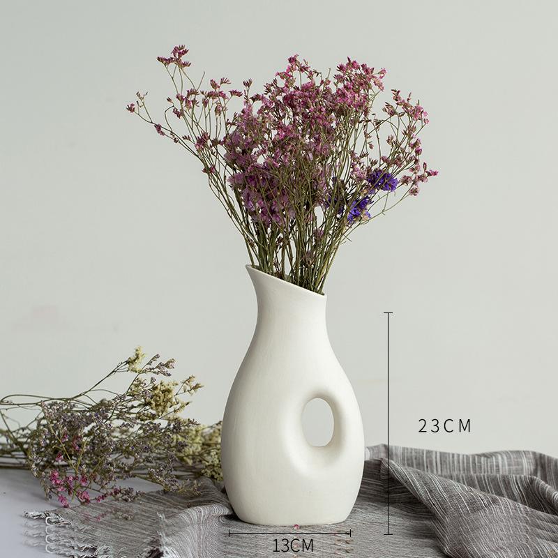 White Ceramic Vase with Dried Baby's Breath for Living Room or Dining Table Decoration