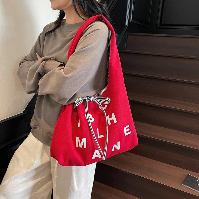 Large capacity double-sided canvas bag women's 2025 new color letter bow shoulder bag fashion student schoolbag
